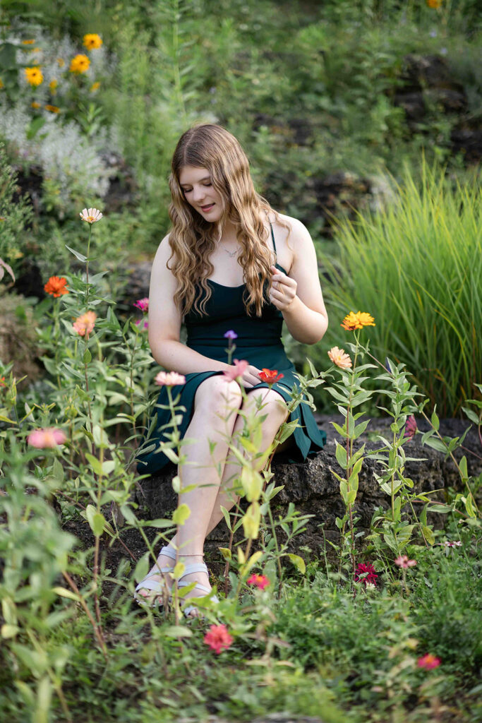 The soft lean is perfect for a warm, inviting portrait. Chloe absolutely nailed it surrounded by the garden blooms.