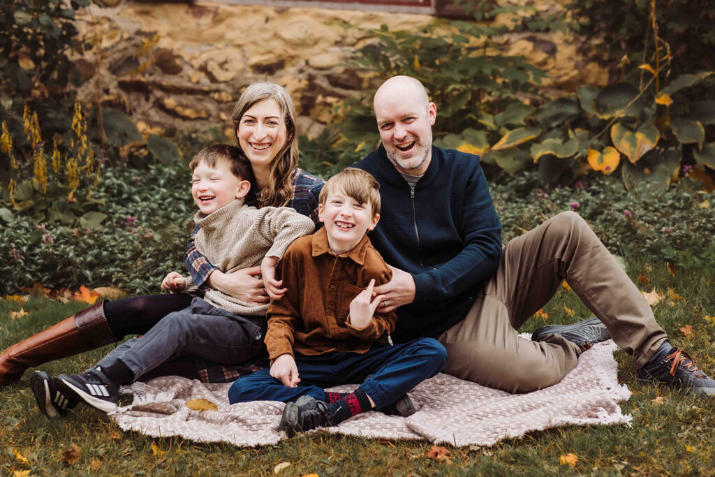 family laughing in fall photo