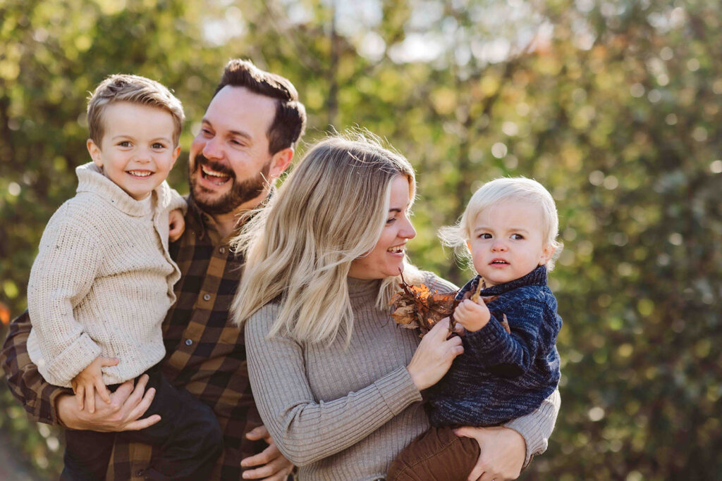 family from Kitchener-Waterloo weariing fall clothing for Fall photoshoot