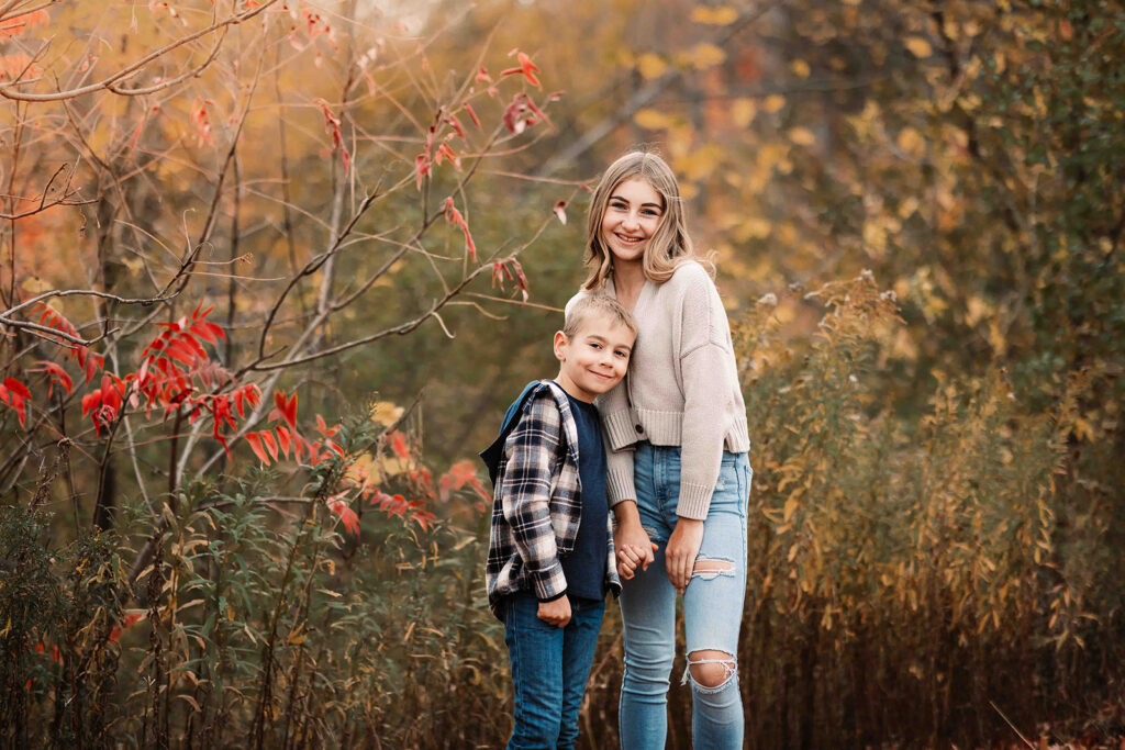 brother and sister in fall setting for fall photoshoot
