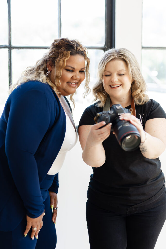 Kitchener-Waterloo branding photographer looking over photos with client