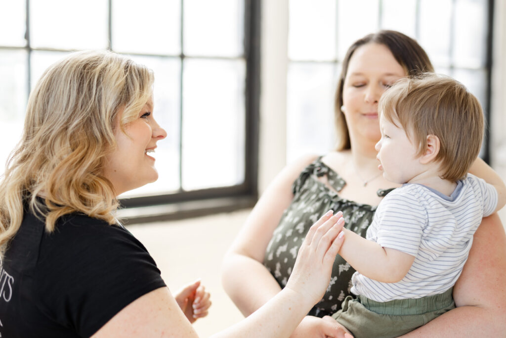 Kitchener-Waterloo branding photographer with client and smiling baby