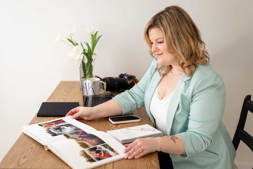 Portraits by Kendra looking through family photo album