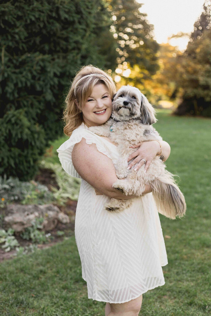 Kendra of Portraits by Kendra with her dog, Oliver.