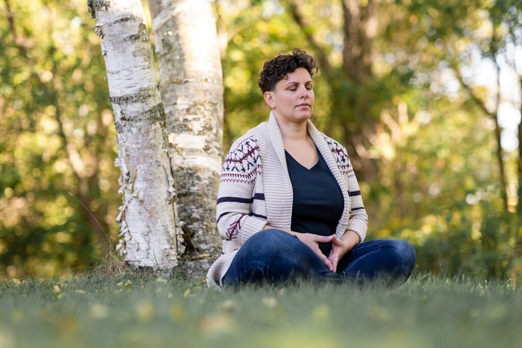 Natural outdoor brand portrait of Energetic Wealth founder Jill, meditating, photographed by Portraits by Kendra.