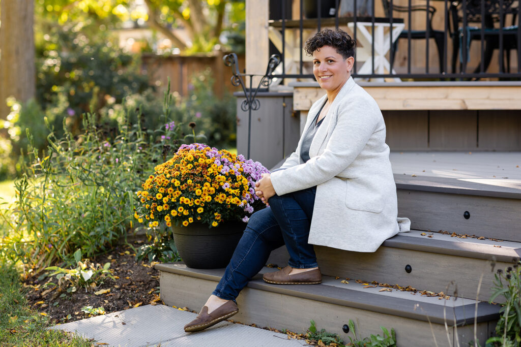 Jill smiling outdoors during her Signature Brand Session with Portraits by Kendra near KW, showcasing her warm and grounded energy.