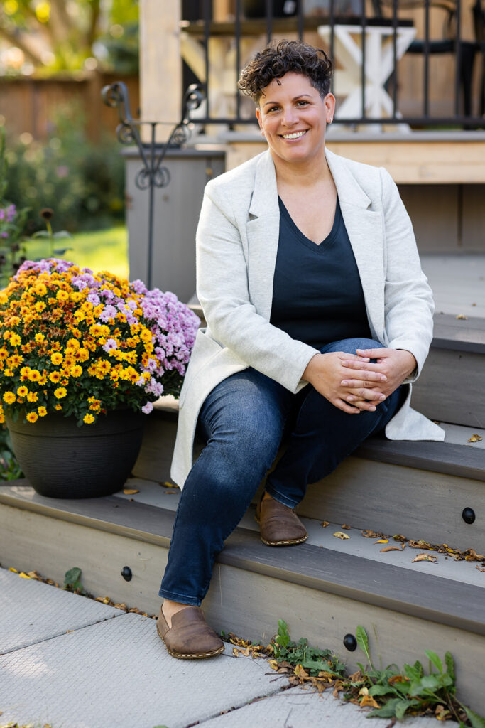 Jill smiling outdoors during her Signature Brand Session with Portraits by Kendra near KW, showcasing her warm and grounded energy.