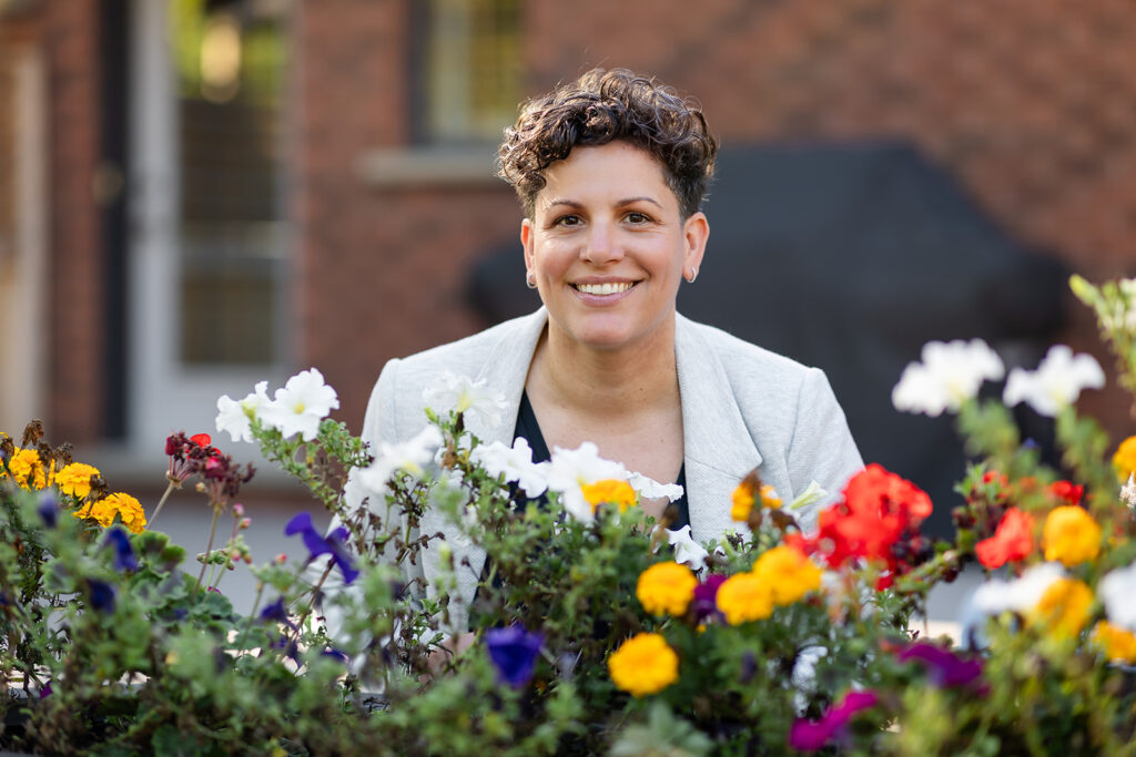 Jill smiling outdoors during her Signature Brand Session with Portraits by Kendra near KW, showcasing her warm and grounded energy.