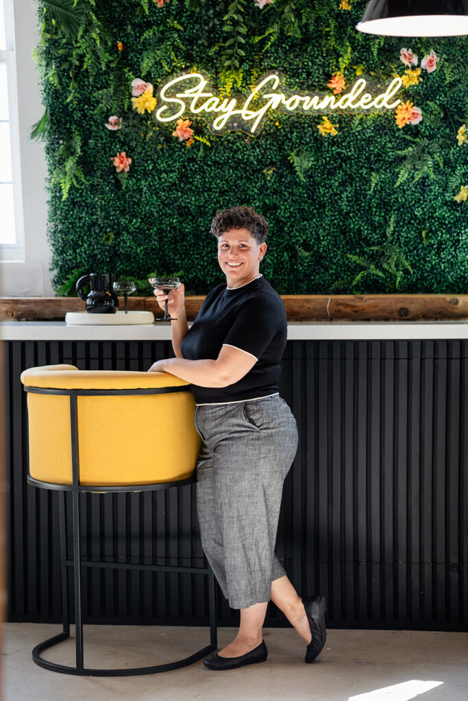 Jill of Energetic Wealth posing in Sunroom Studios during her Signature Brand Session with Portraits by Kendra, photographed in the Kitchener-Waterloo area.