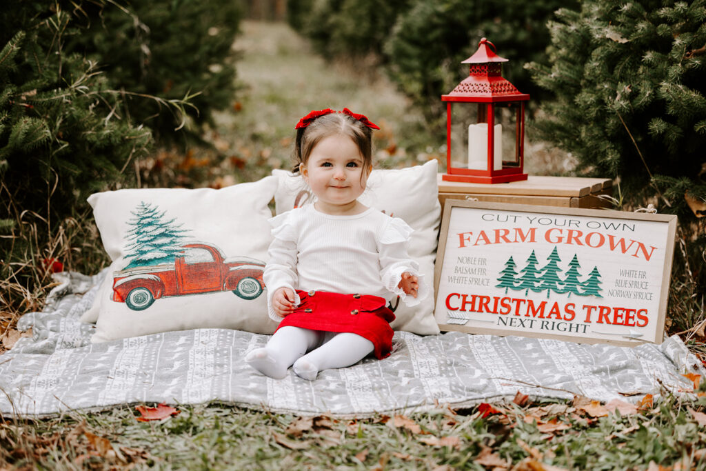 Holiday mini photo session at Chickadee Tree Farm featuring warm family moments among the Christmas trees — captured by Portraits by Kendra, Kitchener-Waterloo family photographer.