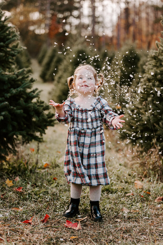 Holiday mini photo session at Chickadee Tree Farm featuring warm family moments among the Christmas trees — captured by Portraits by Kendra, Kitchener-Waterloo family photographer.