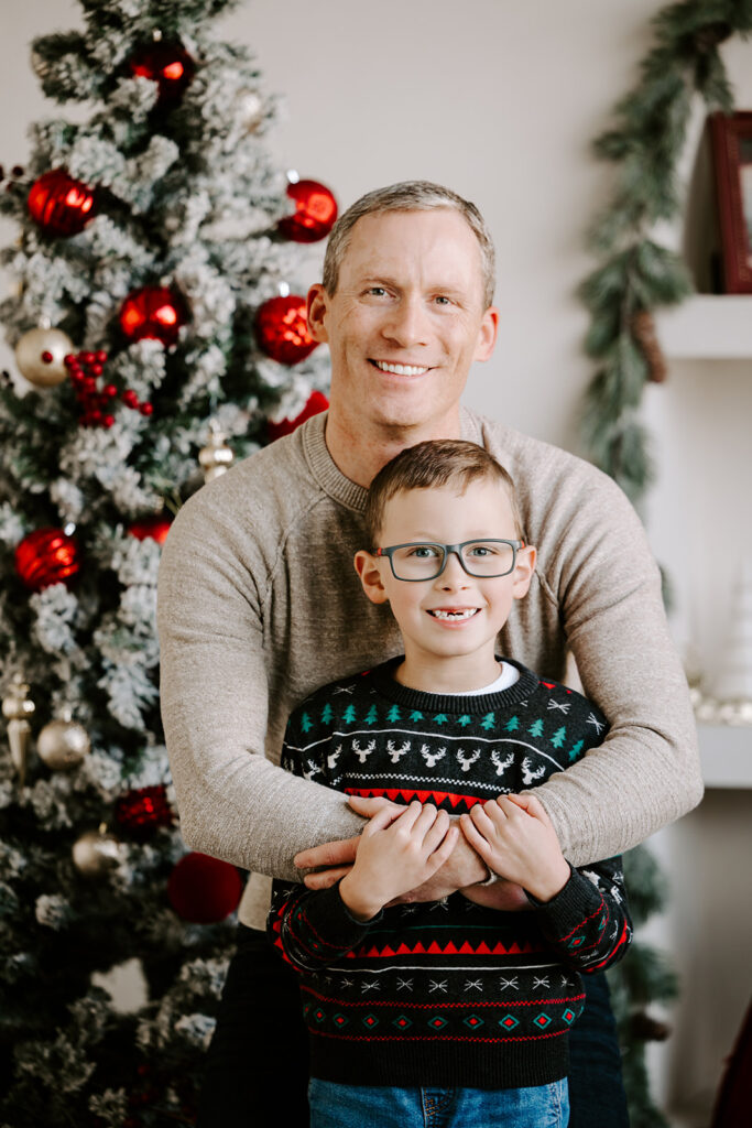A photo of dad and son taken during a holiday studio mini session in Cambridge, Ontario — captured by Portraits by Kendra,Kitchener-Waterloo family photographer.