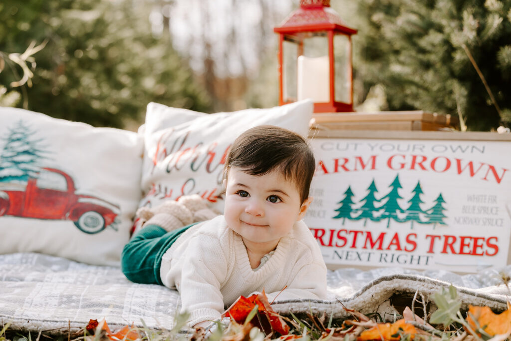 Holiday mini photo session at Chickadee Tree Farm featuring warm family moments among the Christmas trees — captured by Portraits by Kendra, Kitchener-Waterloo family photographer.