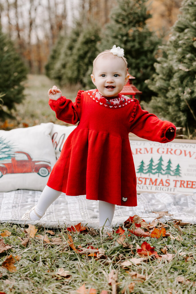 Holiday mini photo session at Chickadee Tree Farm featuring warm family moments among the Christmas trees — captured by Portraits by Kendra, Kitchener-Waterloo family photographer.