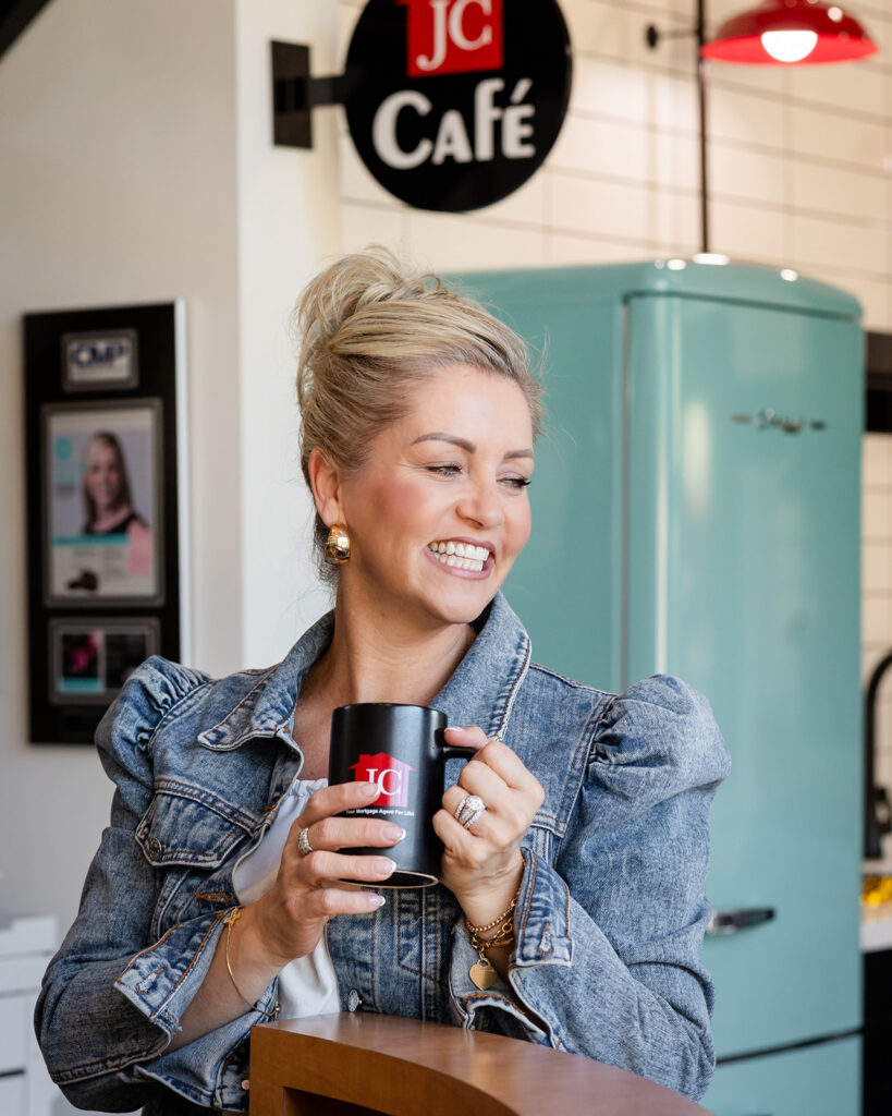 Personal branding portrait of a business owner holding a coffee mug during a lifestyle branding session in Waterloo Region. Photographed by Portraits by Kendra.
