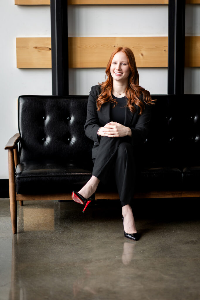 Professional studio headshot of Isabelle sitting on a couch during an Essential Headshot Session in Kitchener-Waterloo by Portraits by Kendra.