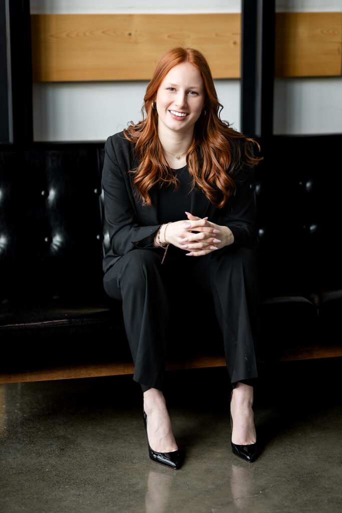 Professional studio headshot of Isabelle sitting on a couch during an Essential Headshot Session in Kitchener-Waterloo by Portraits by Kendra.