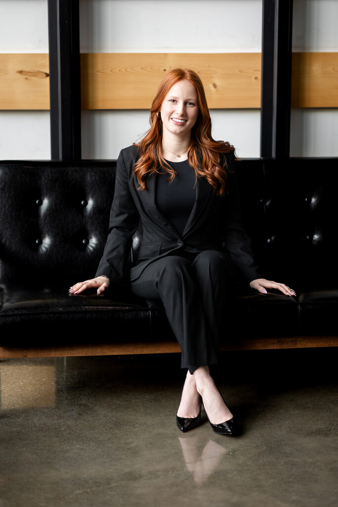 Professional studio headshot of Isabelle sitting on a couch during an Essential Headshot Session in Kitchener-Waterloo by Portraits by Kendra.