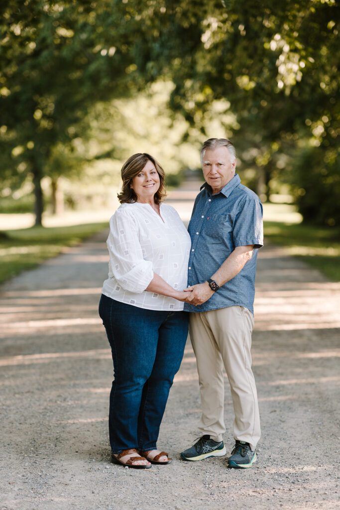 Outdoor photo of grandparents taken at the Guelph Arboretum by Kitchener-Waterloo photographer, PortraitsByKendra