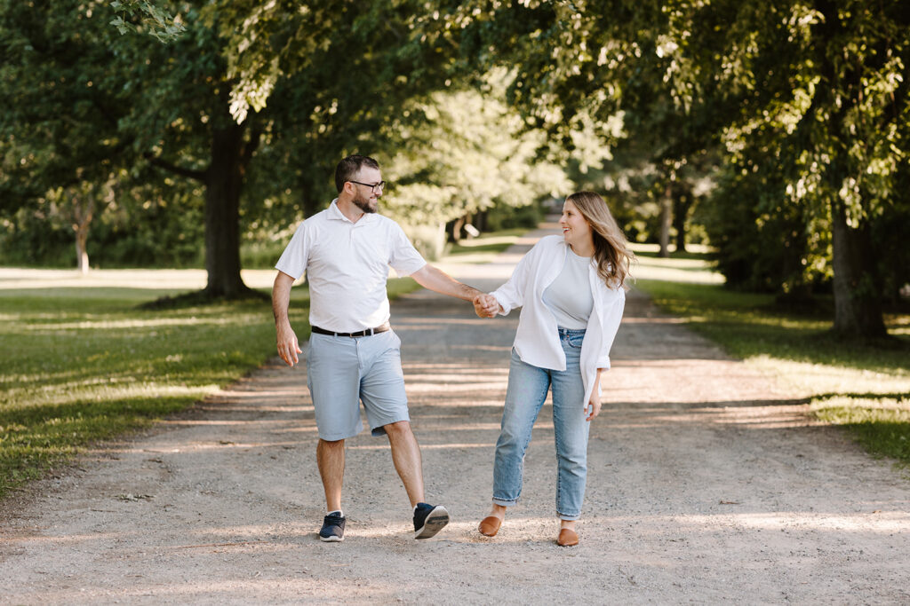 Outdoor photo of couple taken at the Guelph Arboretum by Kitchener-Waterloo photographer, PortraitsByKendra