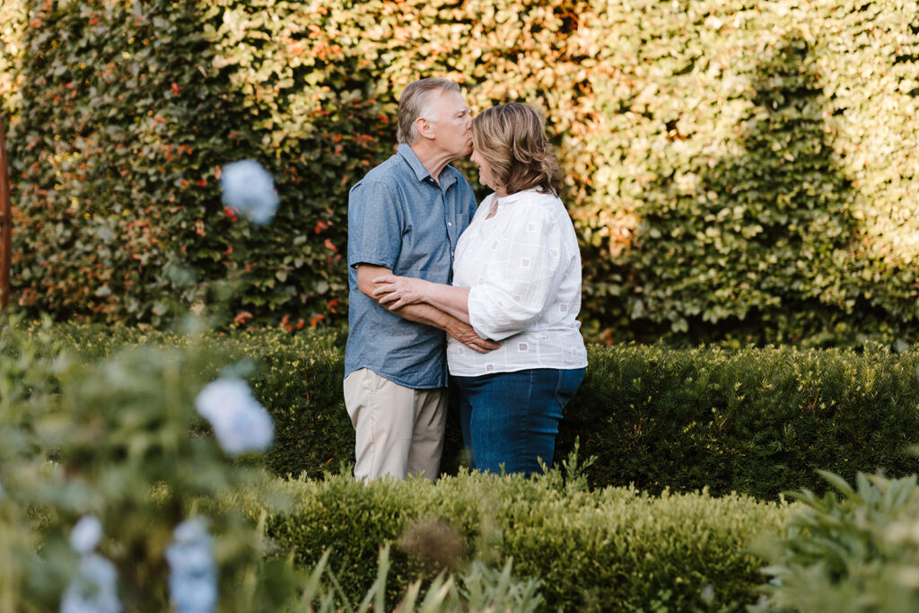 Outdoor photo of grandparents taken at the Guelph Arboretum by Kitchener-Waterloo photographer, PortraitsByKendra