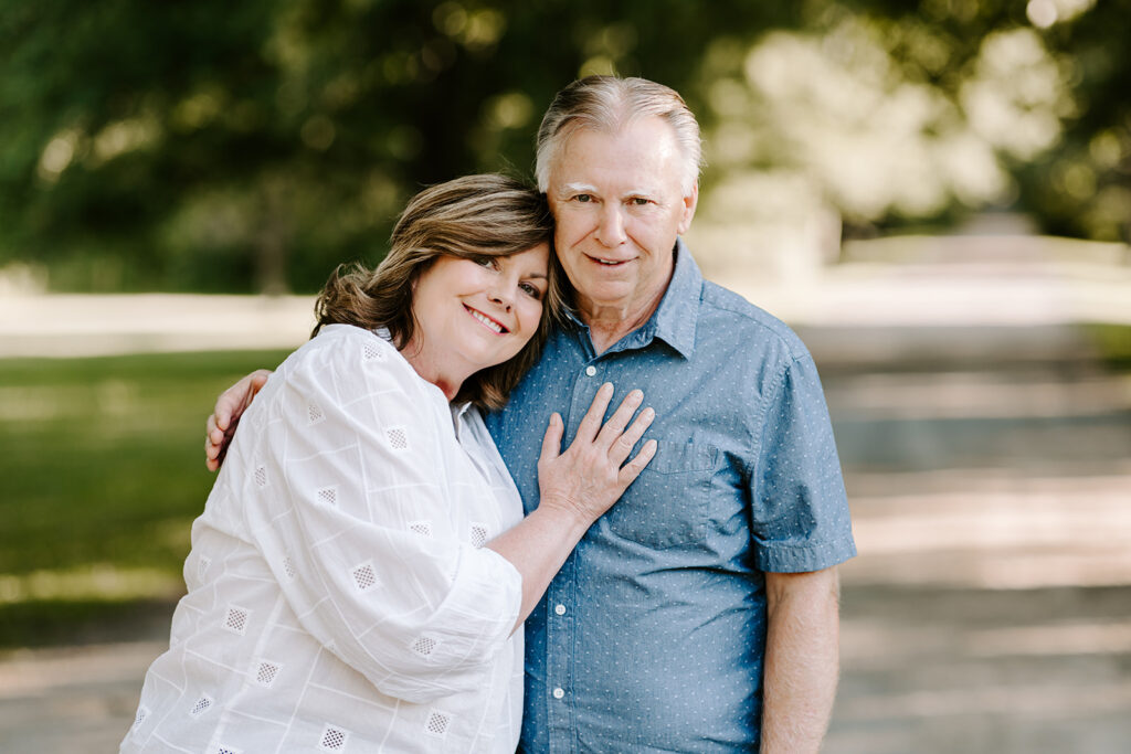 Outdoor photo of older couple taken at the Guelph Arboretum by Kitchener-Waterloo photographer, PortraitsByKendra