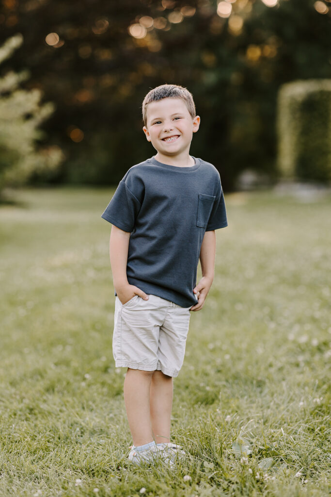 Outdoor photo of young boy taken at the Guelph Arboretum by Kitchener-Waterloo photographer, PortraitsByKendra