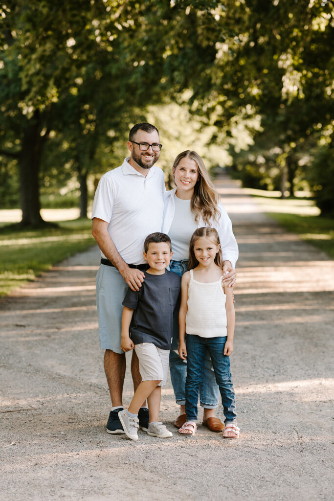 Outdoor photo of family taken at the Guelph Arboretum by Kitchener-Waterloo photographer, PortraitsByKendra