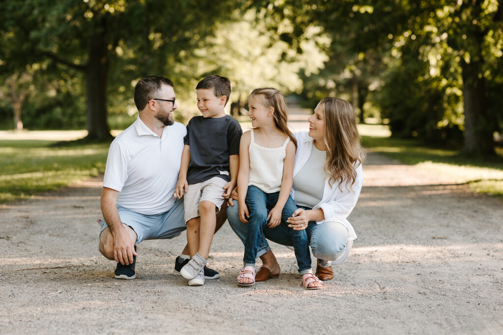 Outdoor photo of family taken at the Guelph Arboretum by Kitchener-Waterloo photographer, PortraitsByKendra