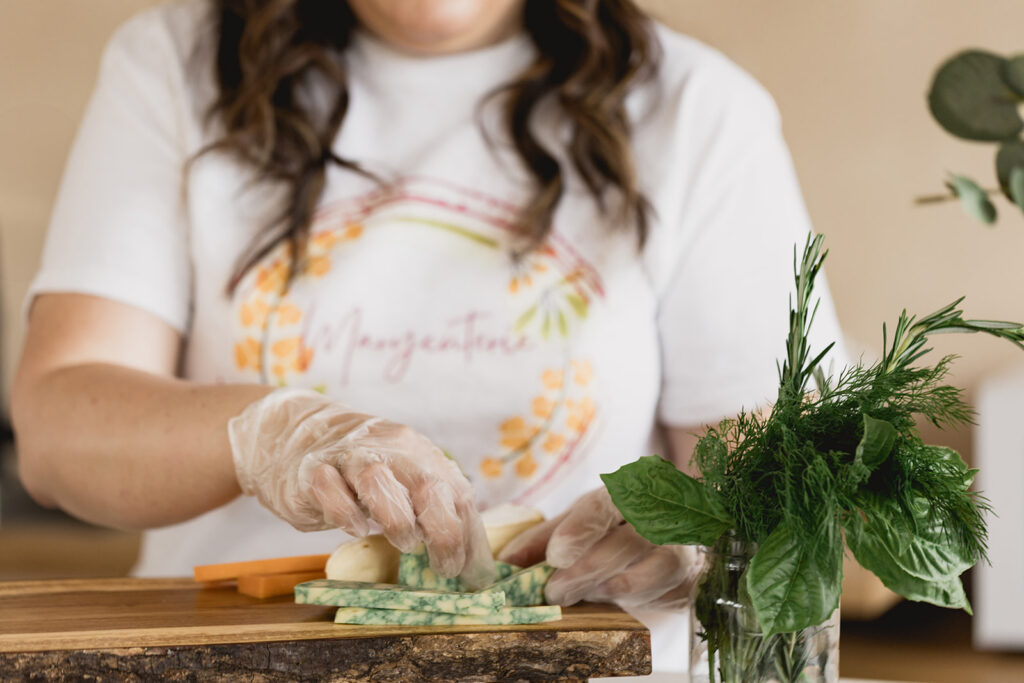 Mary Tchabrazian, owner of Marycuterie, is making a charcuterie board during a branding photoshoot by Portraits by Kendra in Waterloo Region
