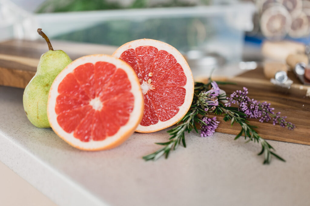 Close-up photo of a grapefruit and pear styled by Marycuterie during a branding photoshoot by Portraits by Kendra