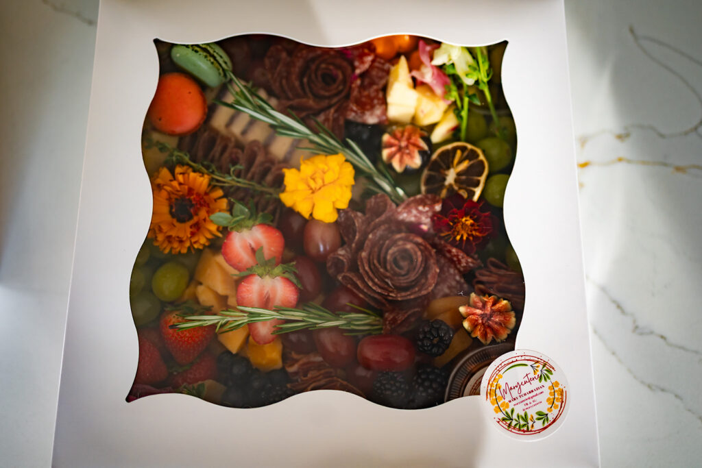 A charcuterie grazing box created by Marycuterie and photographed by Portraits by Kendra during a branding photoshoot in Kitchener-Waterloo