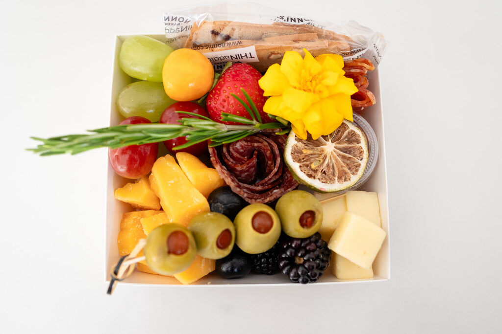 An individual charcuterie grazing box created by Marycuterie and photographed by Portraits by Kendra during a branding photoshoot in Kitchener-Waterloo