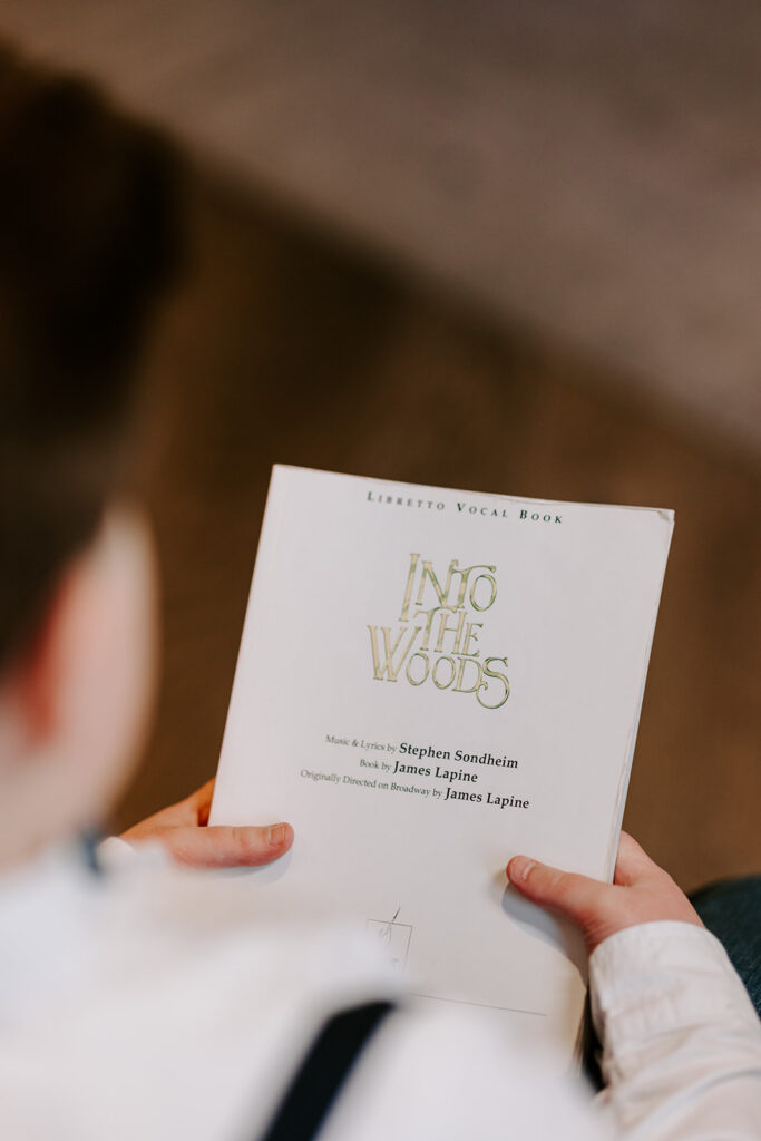 Portrait of teen boy reading a theatre script.  Photo taken by Portraits by Kendra in Kitchener-Waterloo