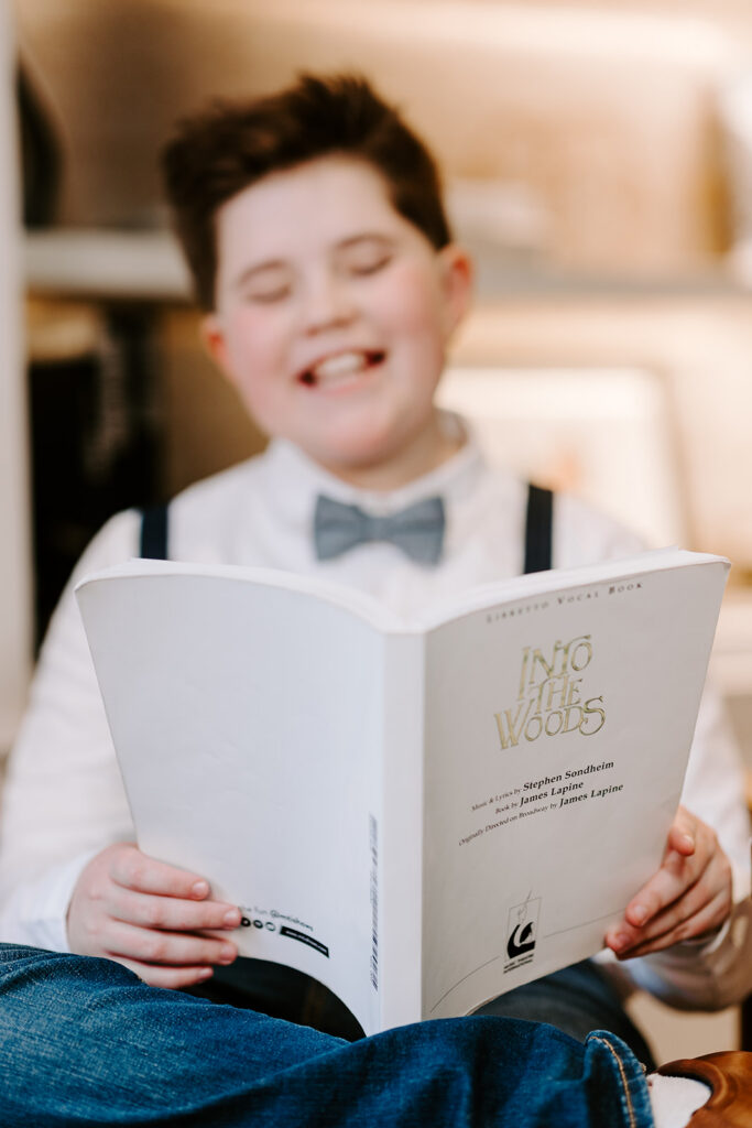 Portrait of teen boy reading a theatre script.  Photo taken by Portraits by Kendra in Kitchener-Waterloo