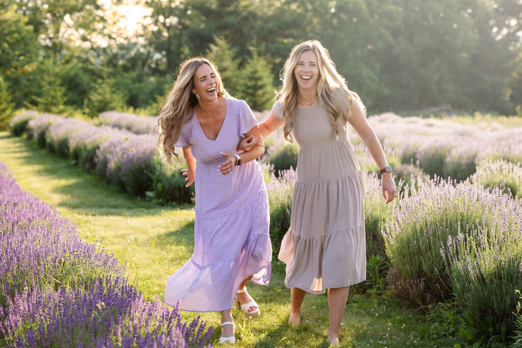 Photo of sisters in a lavender field taken by Portraits by Kendra Photography durng her Golden Hour in the Lavender Fields Limited Edition Photo Session