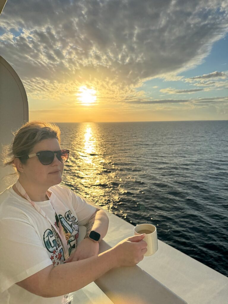 Kendra of Portraits by Kenddra enjoying a mornng coffee on a Carnival Cruise vacation