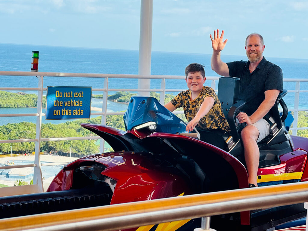 Photo of son and ∂ad on rollercoaster on board the Carnival Celebration cruiseship