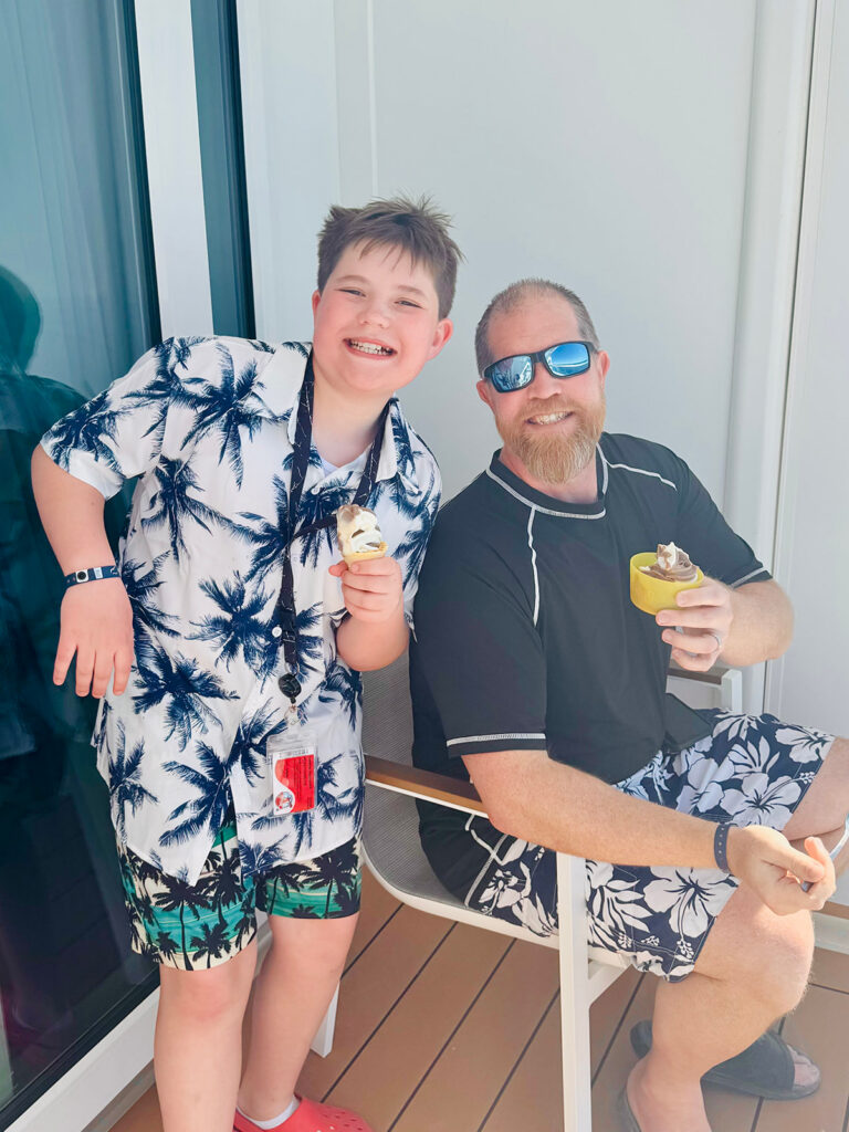 Photo taken by Kendra of Portraits by Kenddra of her husband, Wes and son, Wyatt, eating ice cream on their deck onboard a Carnival Cruise vacation