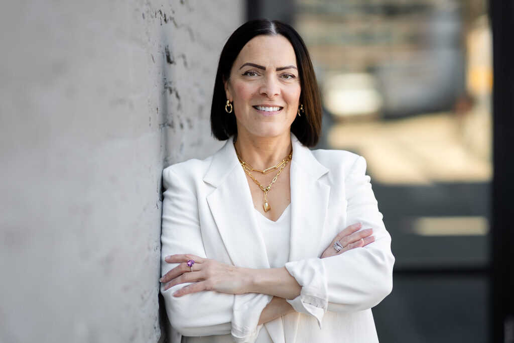 Modern LinkedIn Headshot of woman standing outside photographed in Kitchener-Waterloo  by Portraits by Kendra