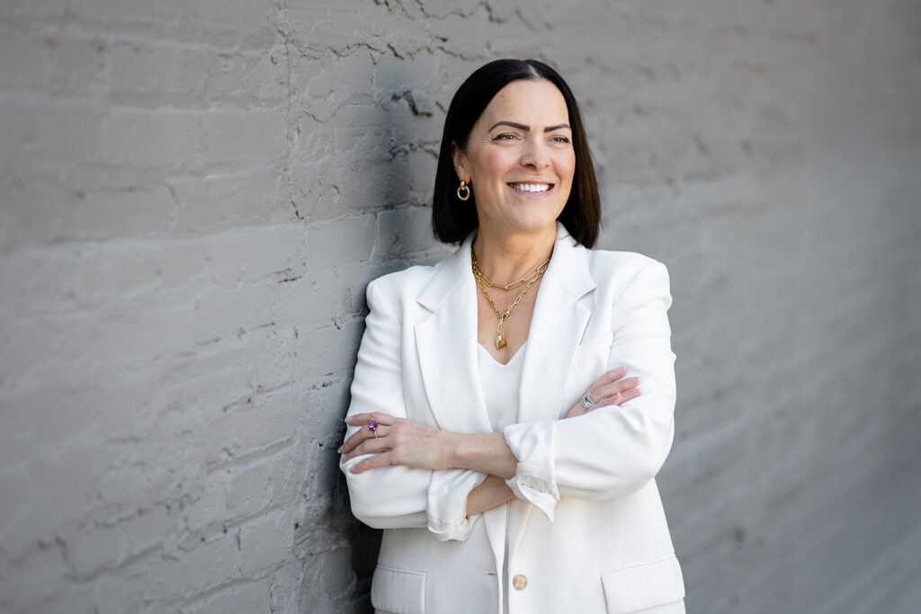 Modern LinkedIn Headshot of woman standing outside photographed in Kitchener-Waterloo  by Portraits by Kendra
