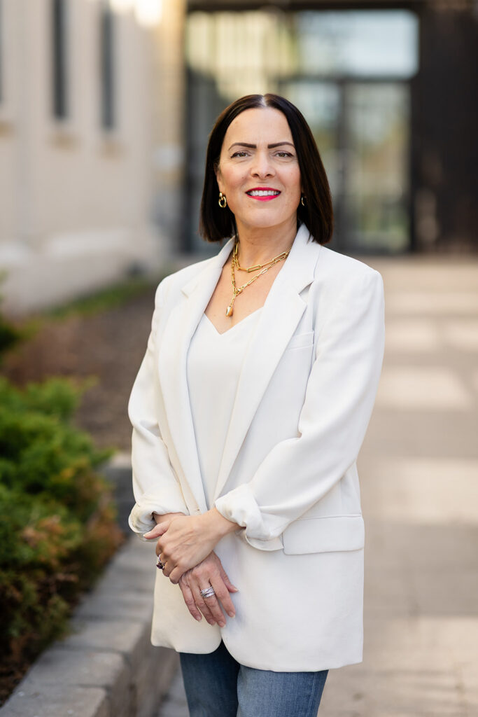 Modern LinkedIn Headshot of woman standing outside photographed in Kitchener-Waterloo  by Portraits by Kendra