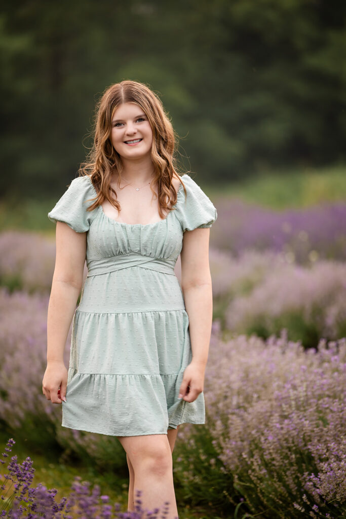 Birthday portrait of teen girl standing in lavender field in Ayr. 