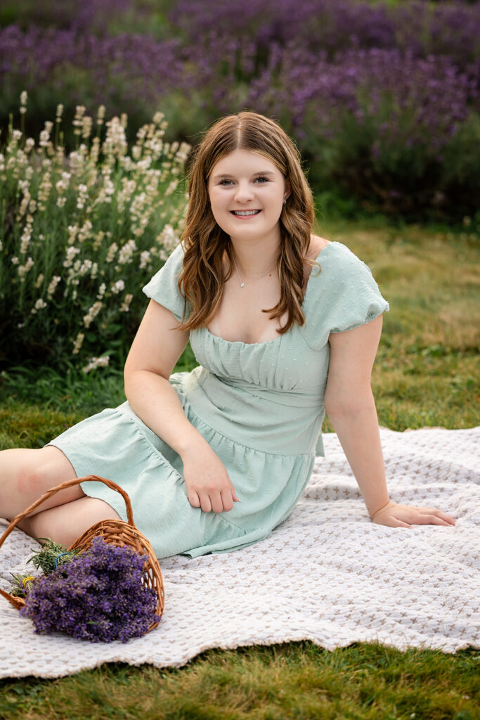 Birthday portrait session of a teen girl sitting on a blanket in a lavender farm in Ayr, Ontario, golden hour natural light photography.