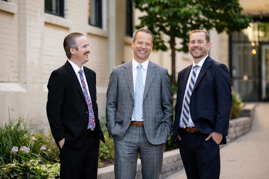 Coworkers laughing together during a corporate photography session